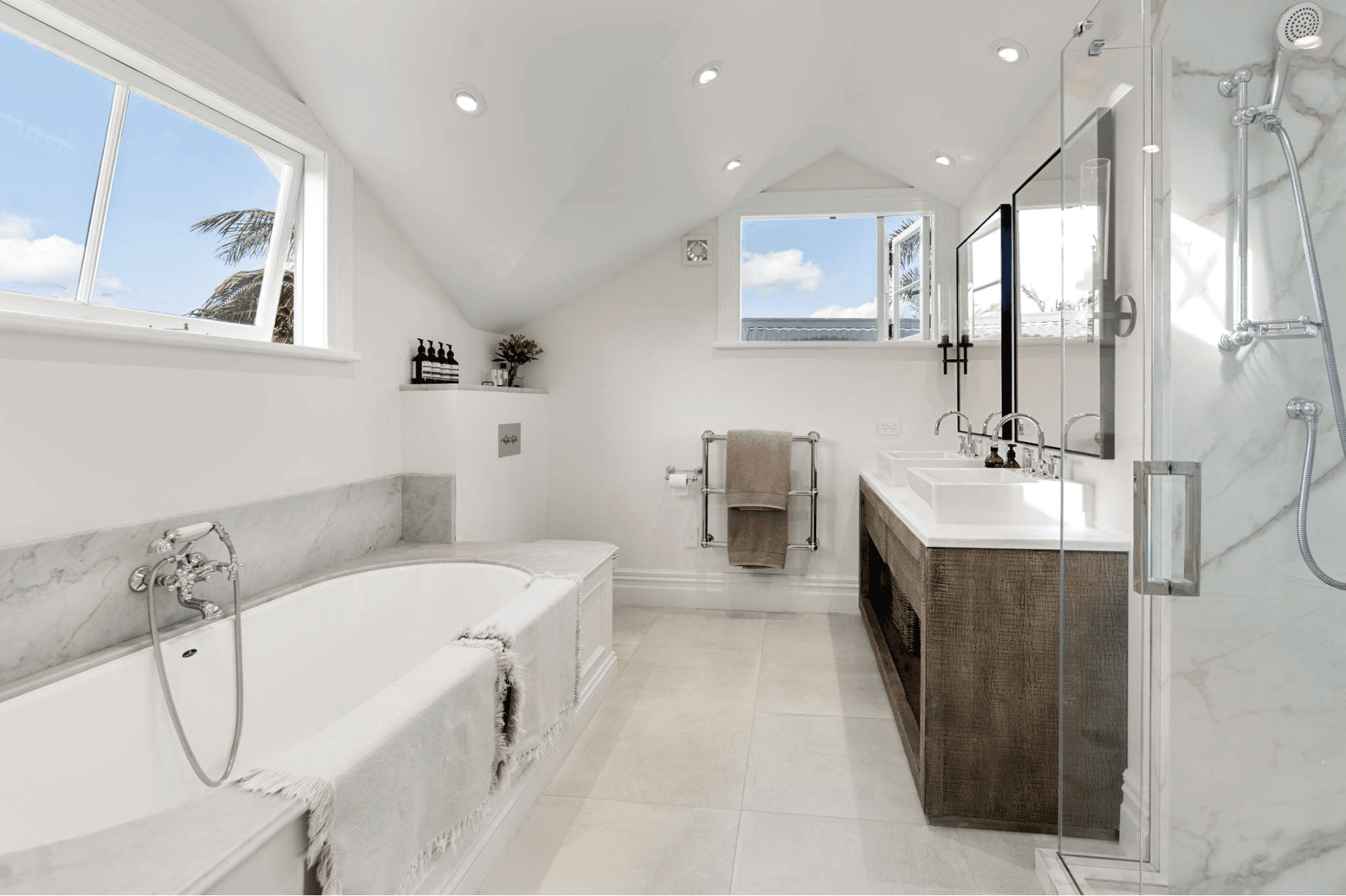 Bright traditional-style bathroom with marble surround